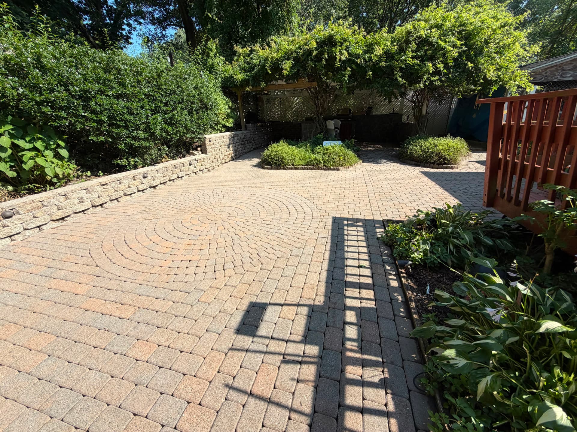 Freshly restored paver patio with circular brick inlay